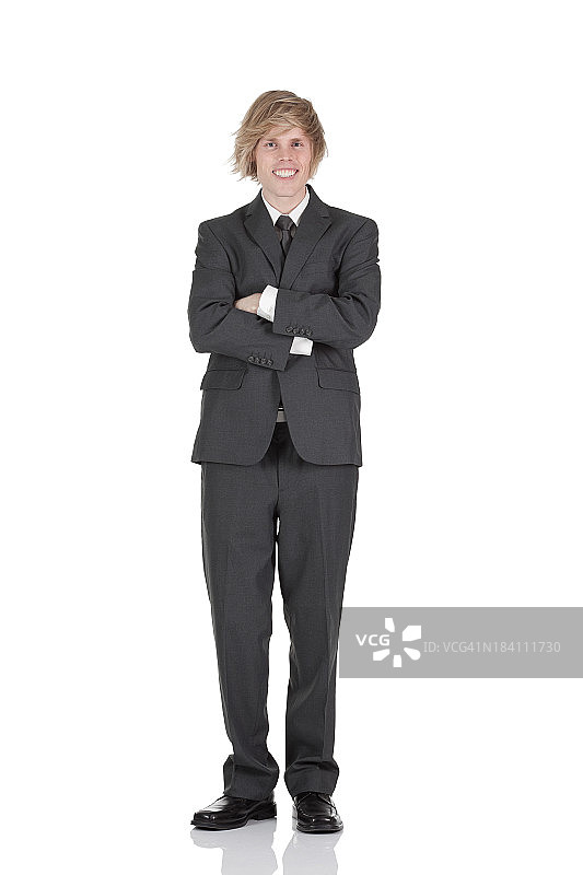 双臂交叉站着的商人图片素材