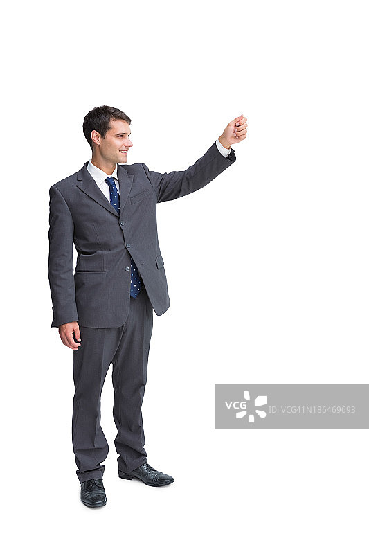 微笑的商人举起某物图片素材