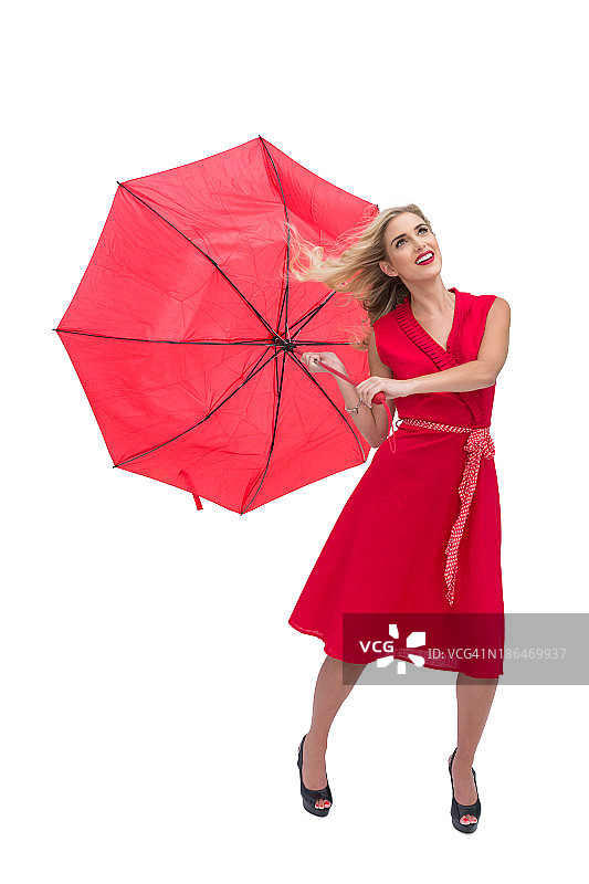 迷人的女人拿着一把破伞图片素材