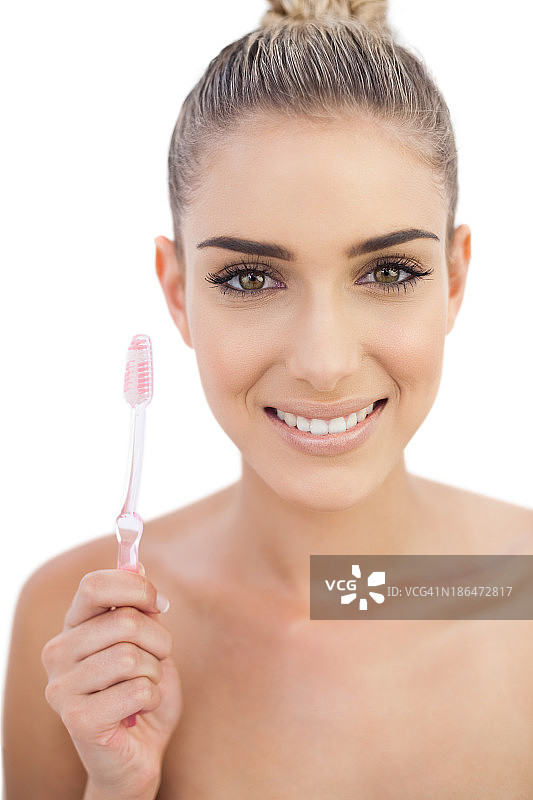 快乐的女人拿着牙刷图片素材