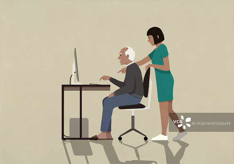 孙女帮助爷爷在书桌前使用电脑图片素材