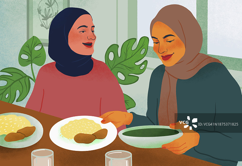 戴着头巾一起用餐的女性朋友图片素材
