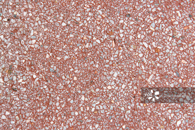 红色地面圆形石块俯视图图片素材