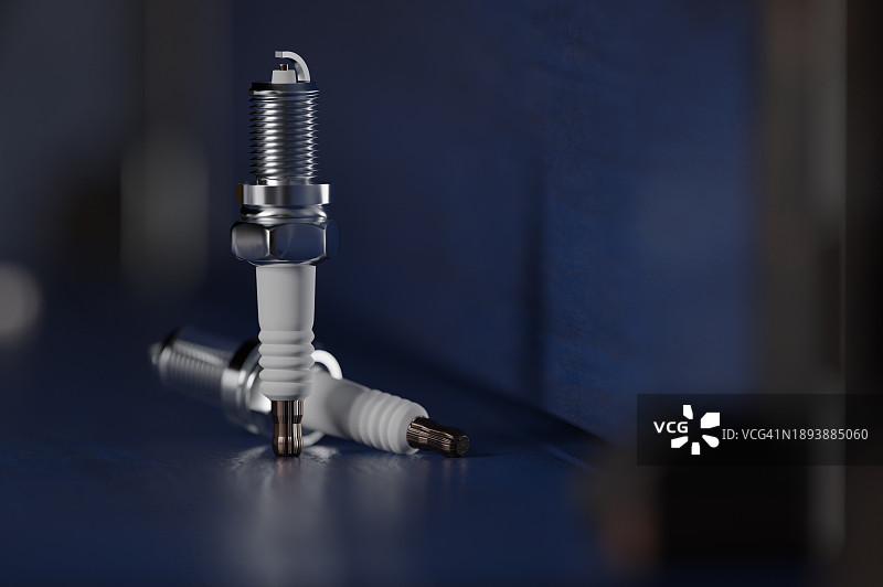 蓝色背景上的火花塞图片素材