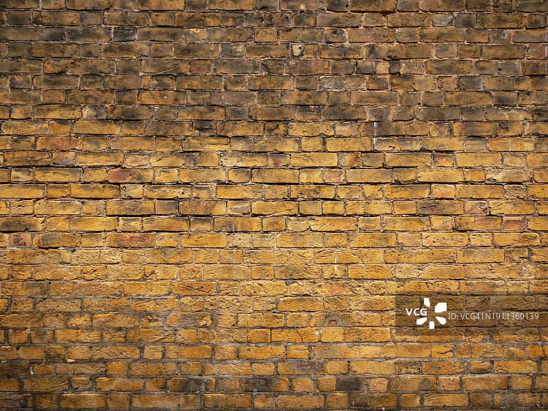 英国伦敦风化的黄棕色砖墙图片素材