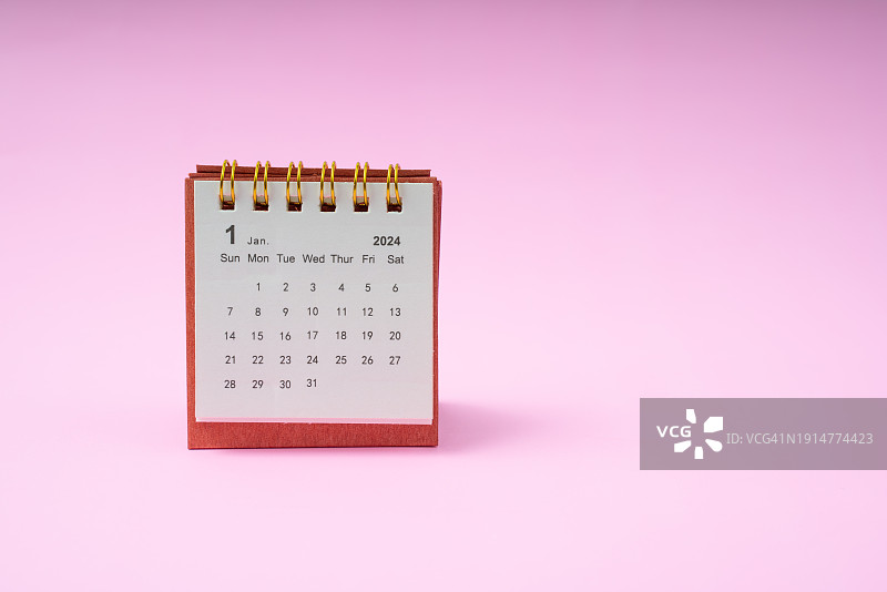 2024年1月粉色背景简约桌面日历，含留白区域图片素材