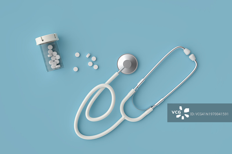 听诊器和处方药瓶中的药丸图片素材
