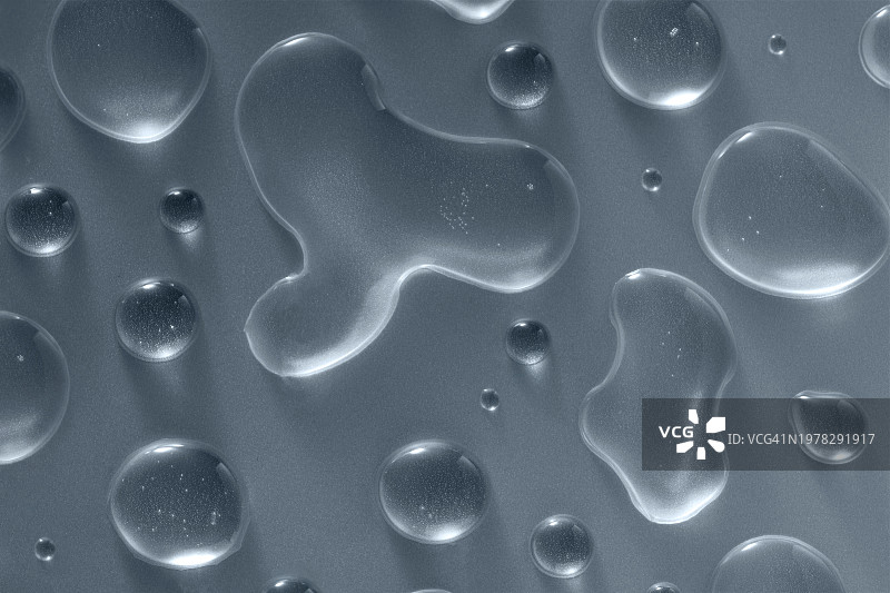 磨砂玻璃表面水滴形成的自然图案，具有复制空间的护肤保湿美容图片素材