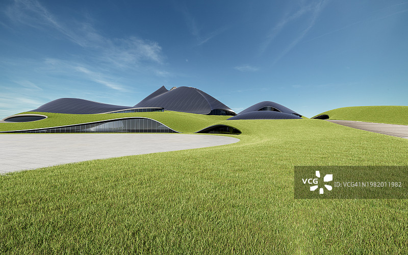 现代建筑银色金属板前的绿色草坪图片素材