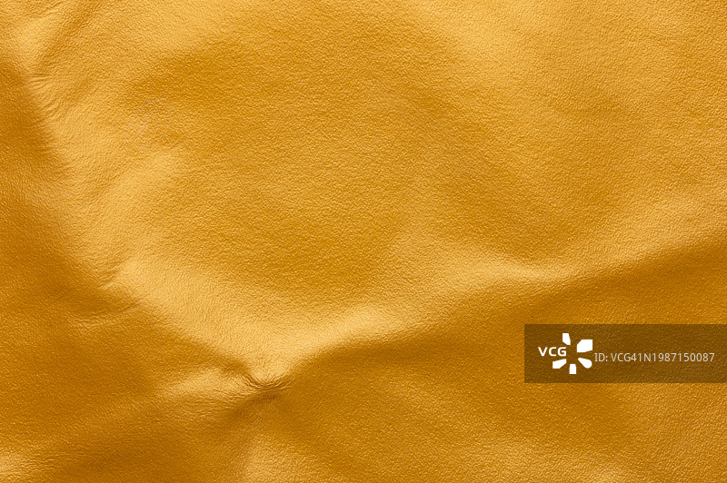 金色皮革背景纹理高分辨率全画幅拍摄图片素材