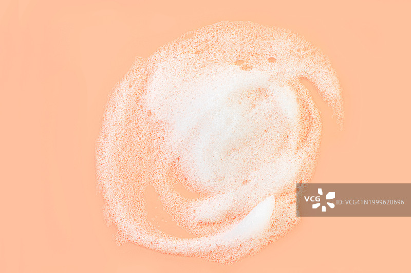 粉米色橙桃色背景上的美容清洁泡沫洁面皂产品图片素材