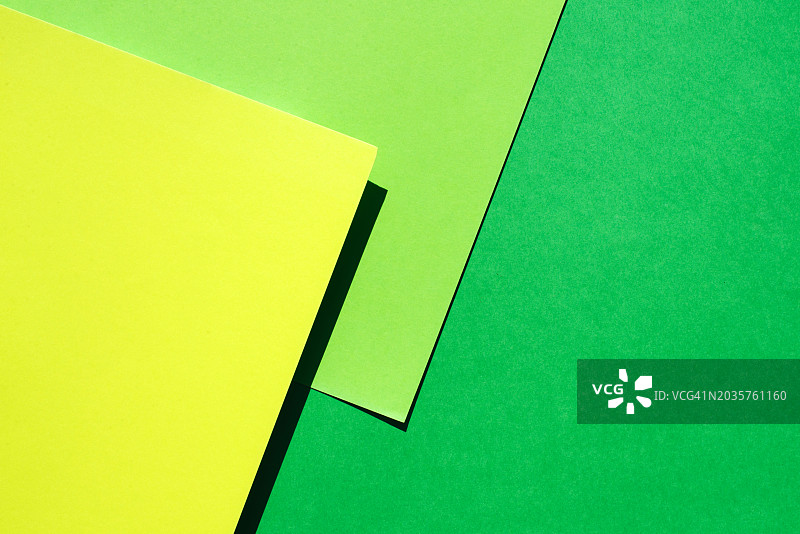 通用彩色背景。文本和图片背景。纸质基底。复制空间。明亮的黄绿色背景。图片素材