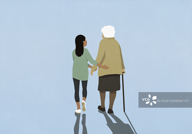 孙女搀扶着拄着拐杖的年迈奶奶图片素材