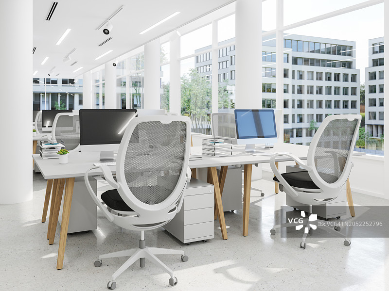 设有办公桌椅和电脑的现代开放式办公空间特写图片素材