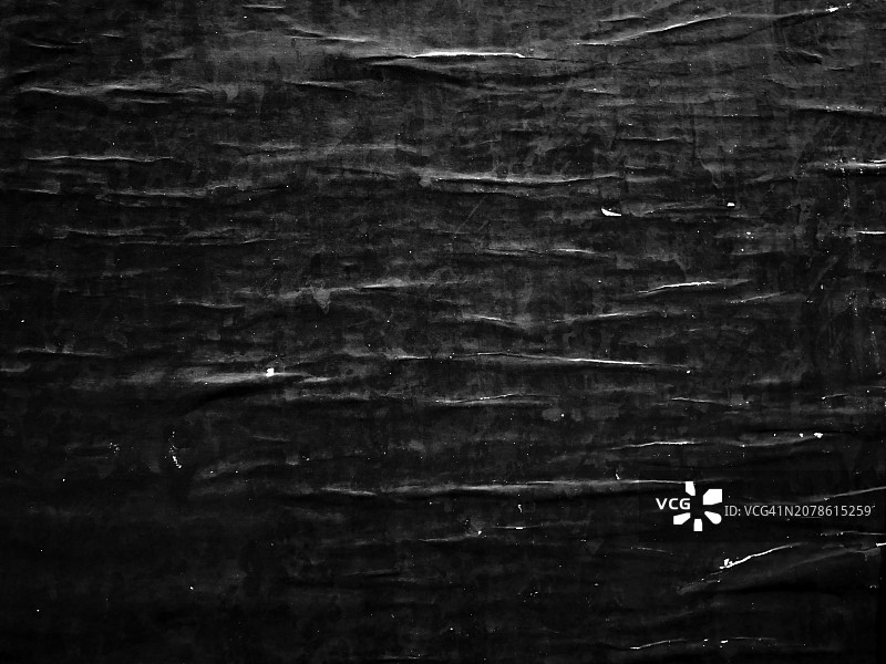巴黎墙上褶皱的黑色海报特写图片素材