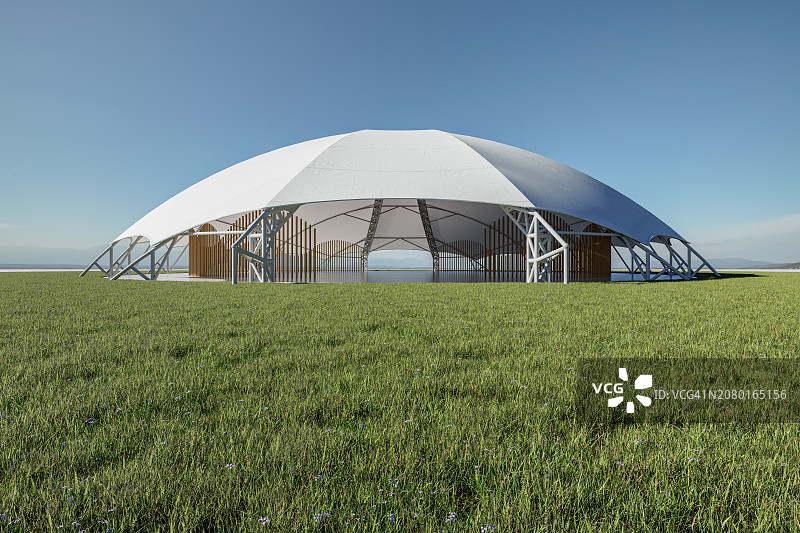 天空下郁郁葱葱的草坪上的活动帐篷图片素材