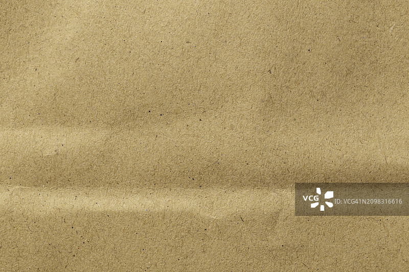 棕色生态再生牛皮纸片纹理纸板背景。图片素材