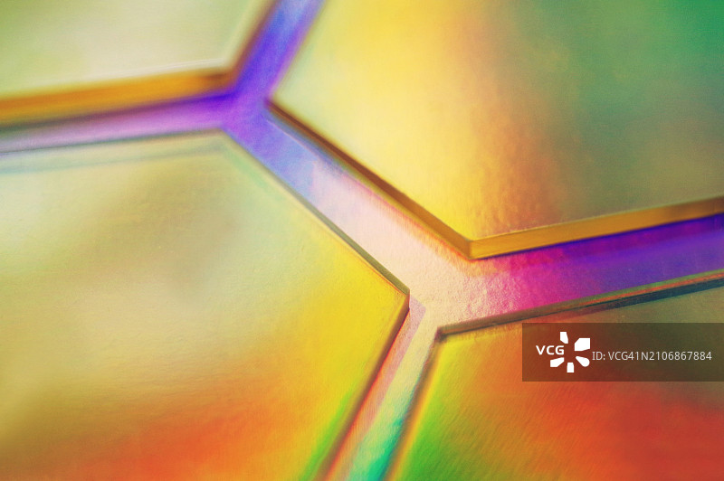 全息箔背景上的半透明黄色六边形图片素材