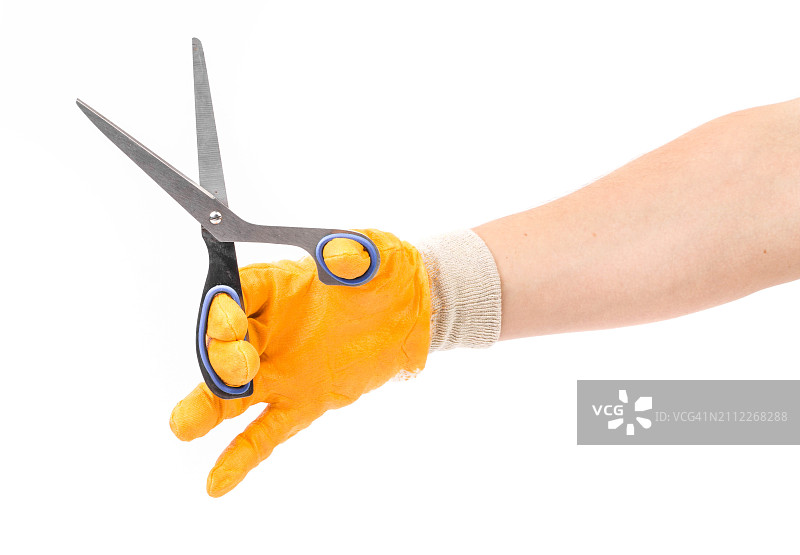 裁剪的手拿着剪刀在白色背景前图片素材