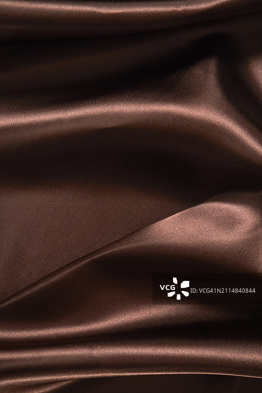 棕色波浪缎面纹理背景，奢华产品展示布料图片素材