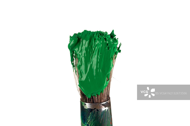 白色背景上带有绿色油漆的刷子图片素材