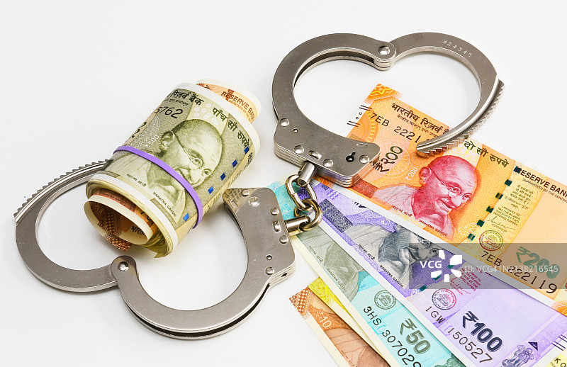 印度货币和手铐图片素材