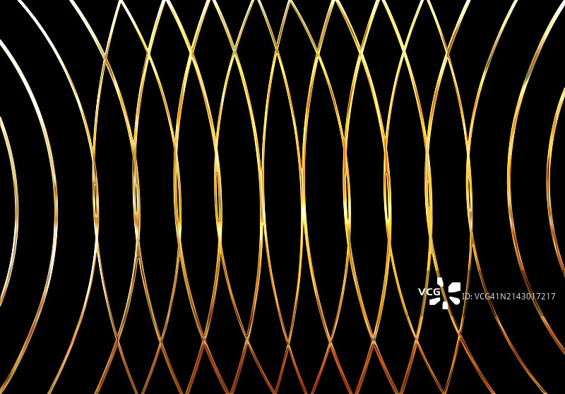 黑色背景上的椭圆形金色金属抽象背景图片素材