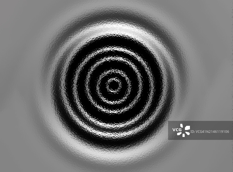 灰色背景上的同心圆水波纹图片素材