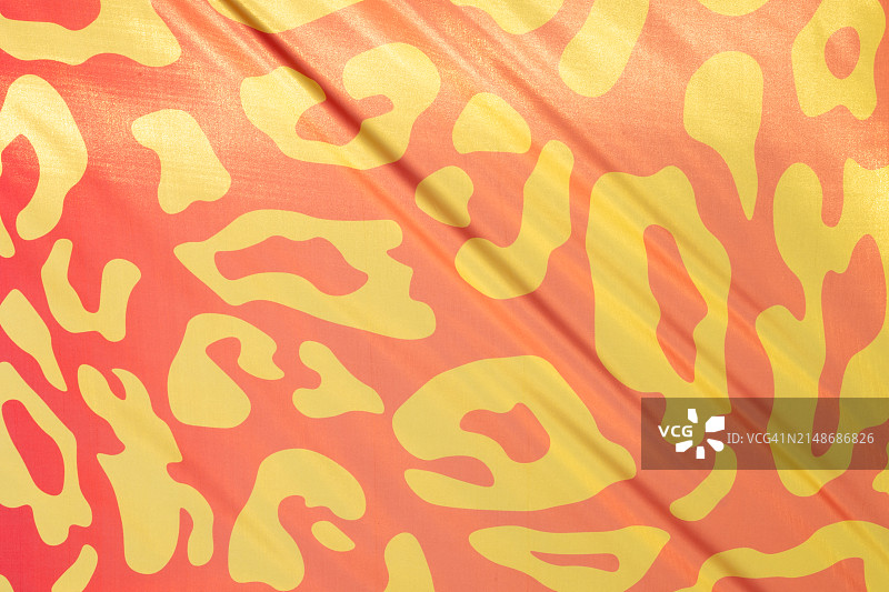 亮粉色和黄色格子图案，中心有一朵黄花图片素材