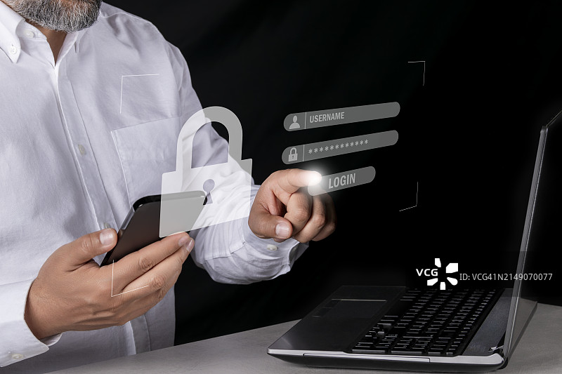 网络安全概念：信息安全与加密。商人使用智能手机触摸虚拟屏幕登录密码以保护数据和安全地访问互联网。图片素材