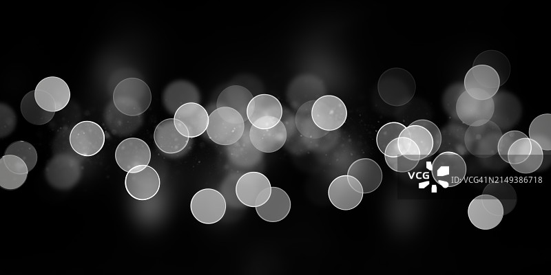 深色背景上的白色散焦灯光图片素材