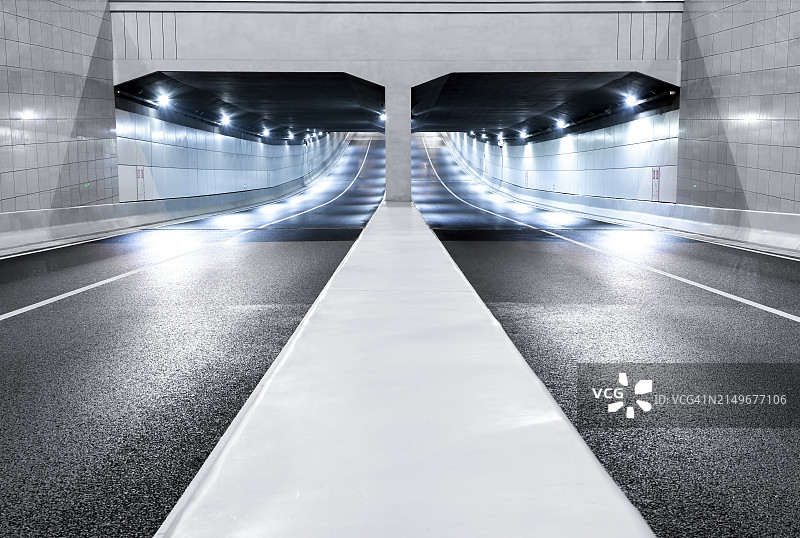 通往隧道的沥青路，汽车商业背景图片素材