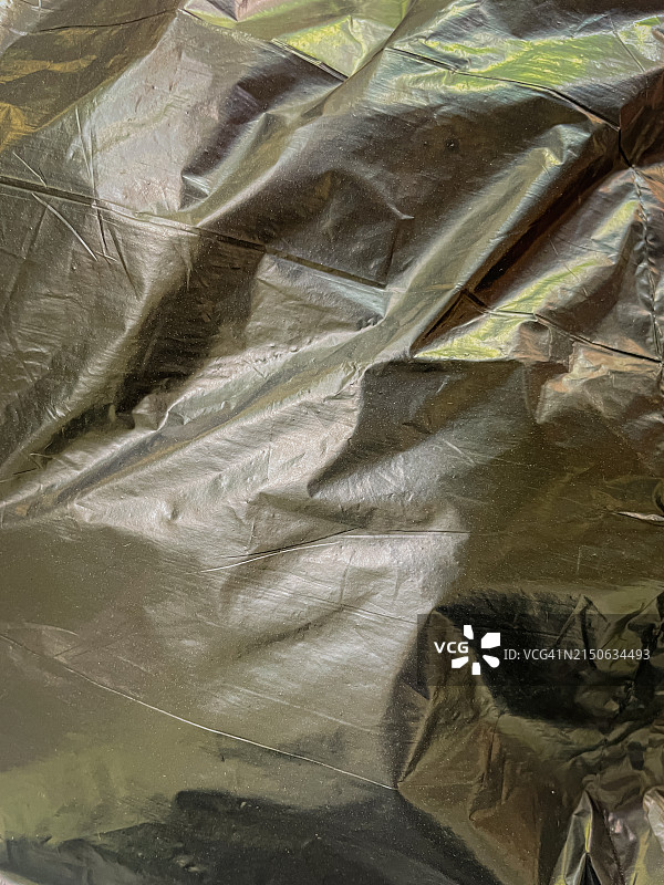 黑色塑料背景特写，黑色纸的抽象背景图片素材