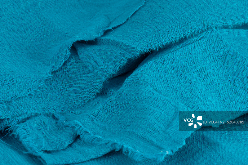 蓝色棉质面料与磨损的边缘图片素材