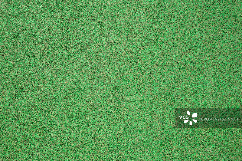 儿童游乐场上的绿色橡胶垫背景图片素材