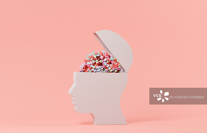 装满药丸的开放式头部造型图片素材