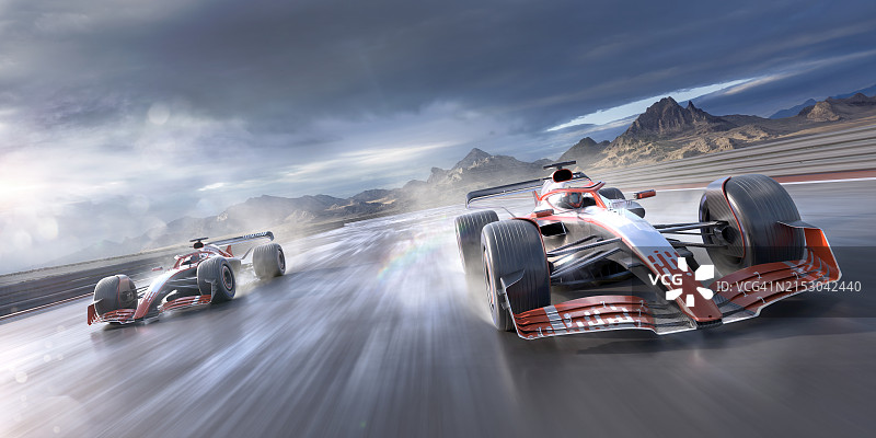 在湿滑赛道上飞驰的两辆赛车图片素材