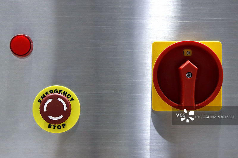 工厂机器上的紧急按钮图片素材