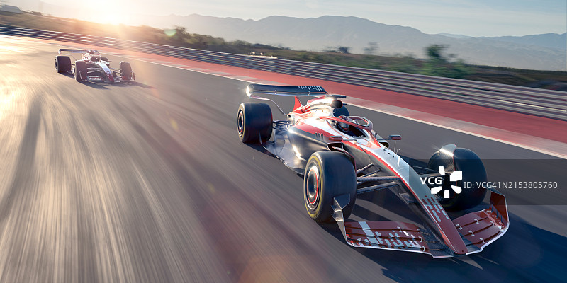 赛道上高速行驶的两辆赛车图片素材