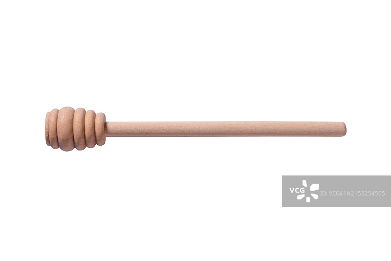 白色背景上孤立的米色木制蜂蜜勺图片素材