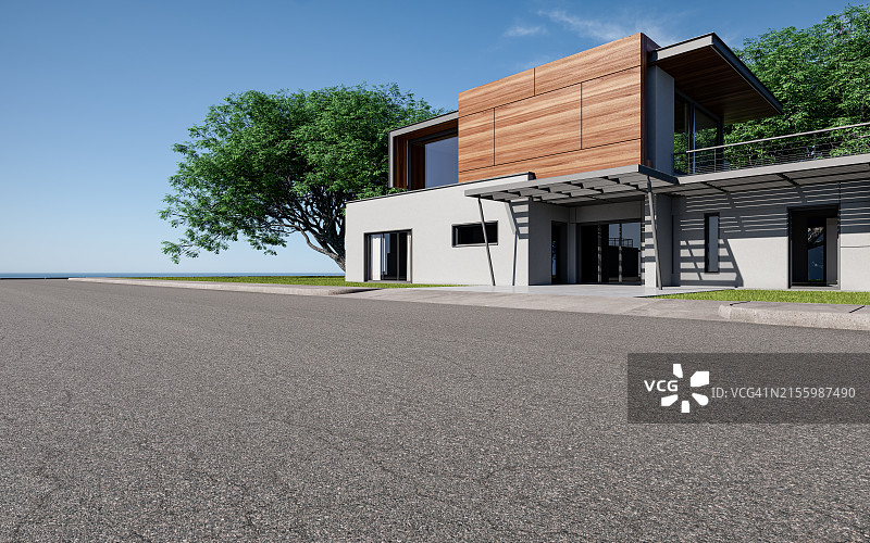 海滨现代别墅旁的沥青路图片素材