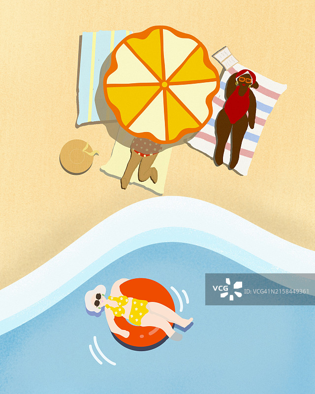 在海滩边沙滩上享受日光浴的女人图片素材