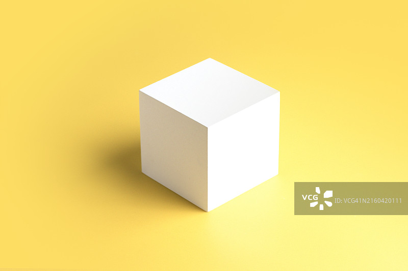 黄色背景上的白色立方体图片素材