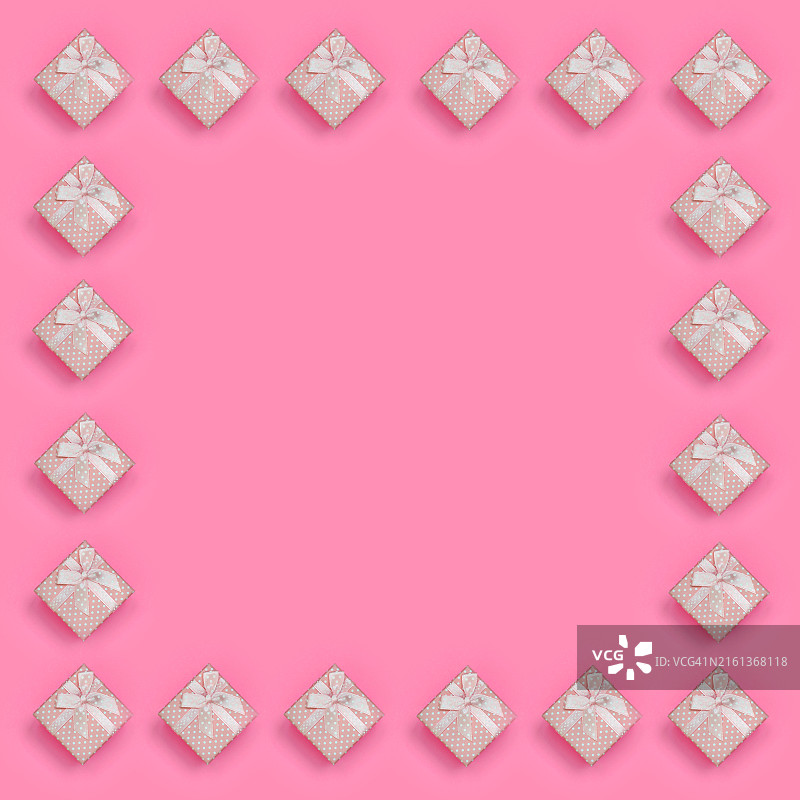 粉色礼品盒在时尚粉色背景上的框架图片素材