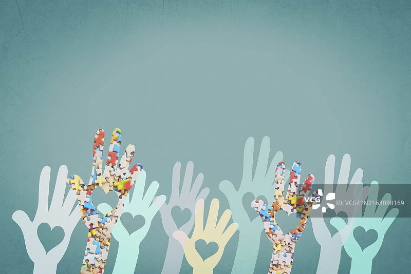 自闭症、多动症、注意力缺陷多动障碍、精神健康，双手拿着彩色拼图图片素材