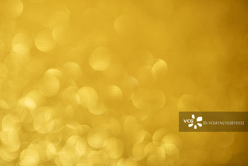 带散景和散焦灯光的抽象圣诞背景金色背景图片素材