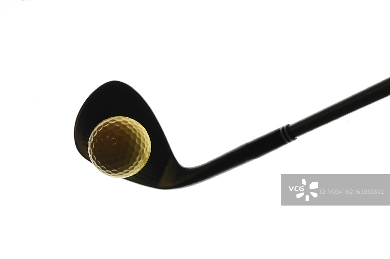 投球挖起杆和高尔夫球图片素材