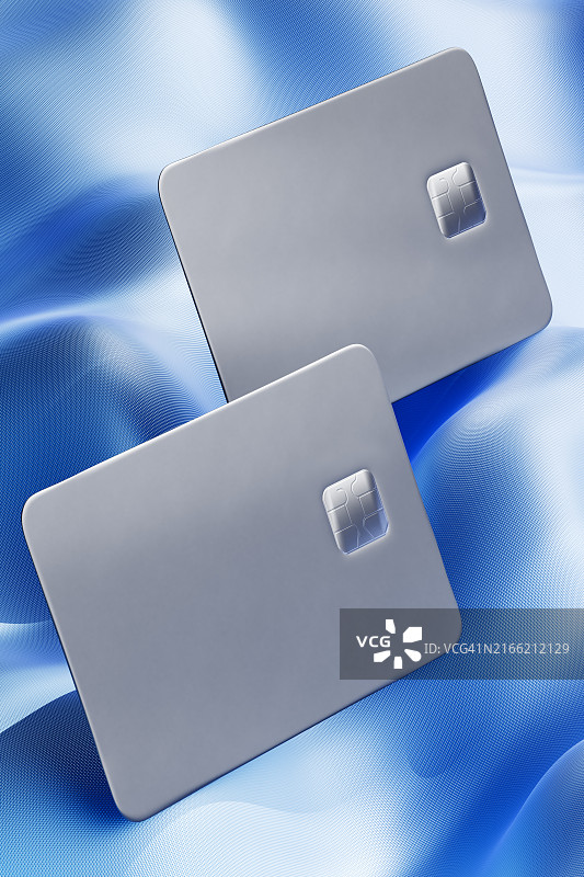 以动态漩涡图案排列的信用卡：增强您的财务能力 - 现代银行解决方案图片素材