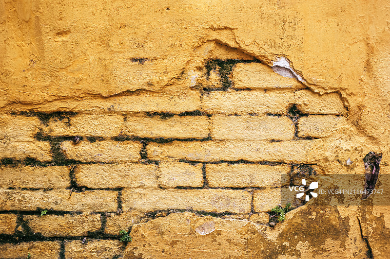 越南会安古镇的油漆剥落砖墙图片素材