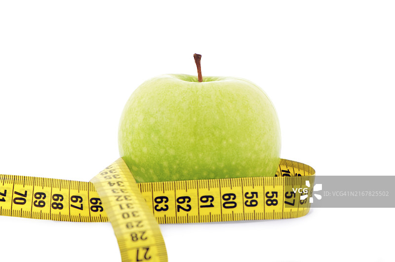 青苹果与黄色卷尺特写图片素材
